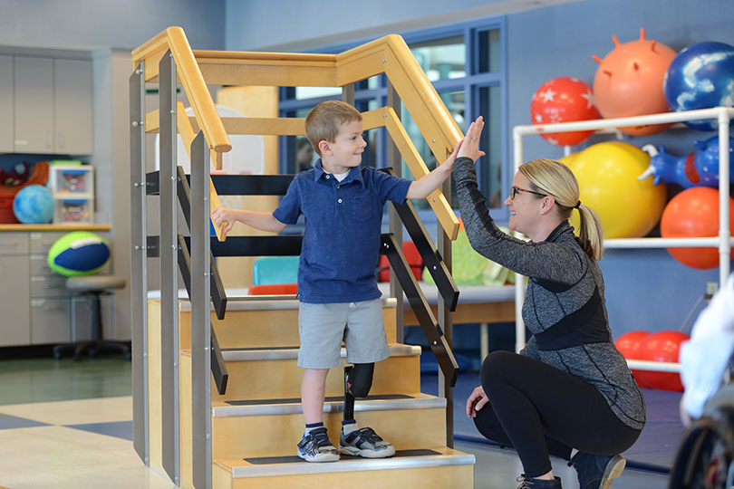 physical-therapy-with-boy-at-shriners-hospitals
